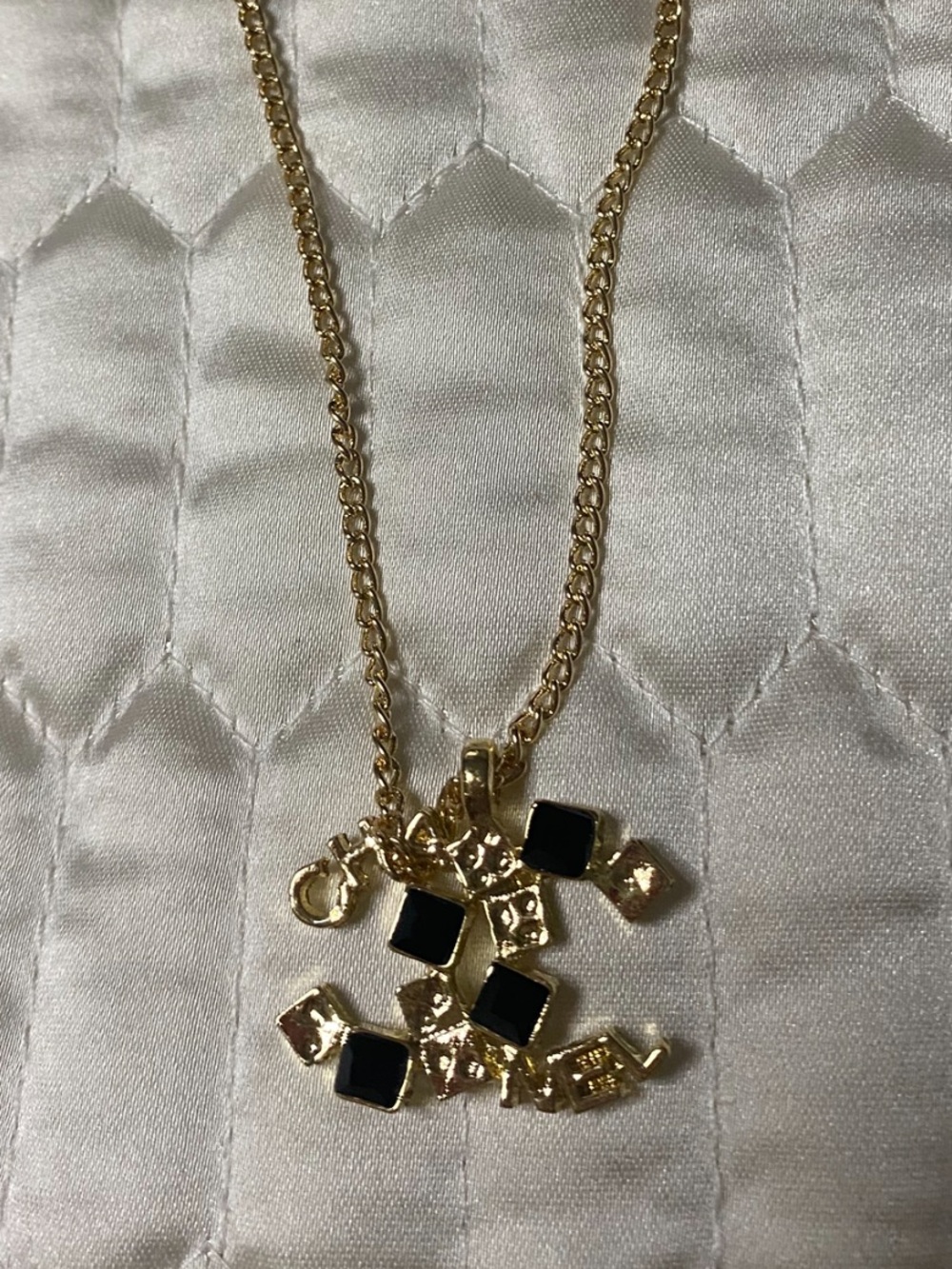 ChaneI. Spellout Dice Necklace Gold- Tone with Black accents